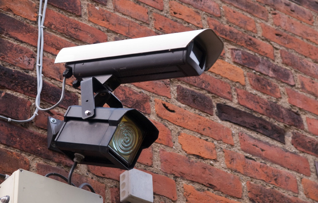 CCTV camera mounted on a brick wall