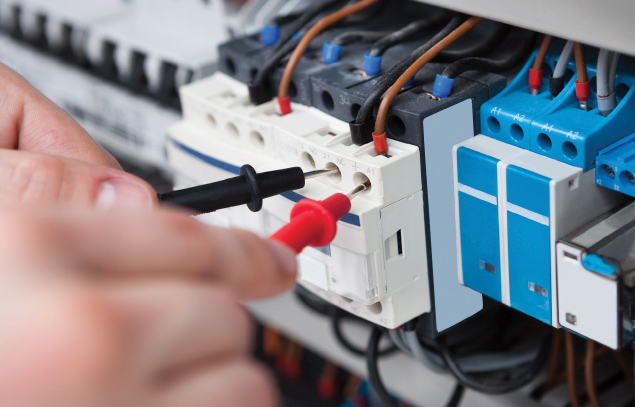 Electrician testing a circuit with test probes