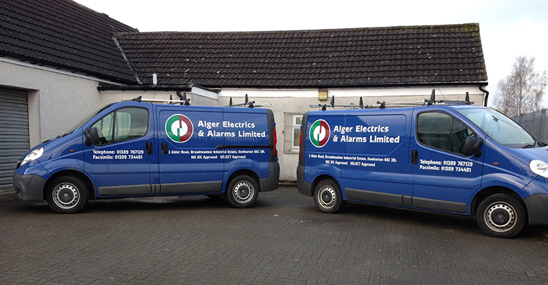 Two Alger Electrics & Alarms liveried vans outside the company premises